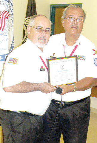 SAVA President Lou Velez honors past president Rafael Rodriguez for his 13-years as leader of the Organization. 