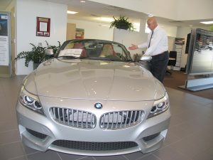 Mundy Burruezo shows a convertible BMW to Renee Dupont at the Melbourne BMW dealership located at 1432 S. Harbor City Blvd., Melbourne, FL 32901.